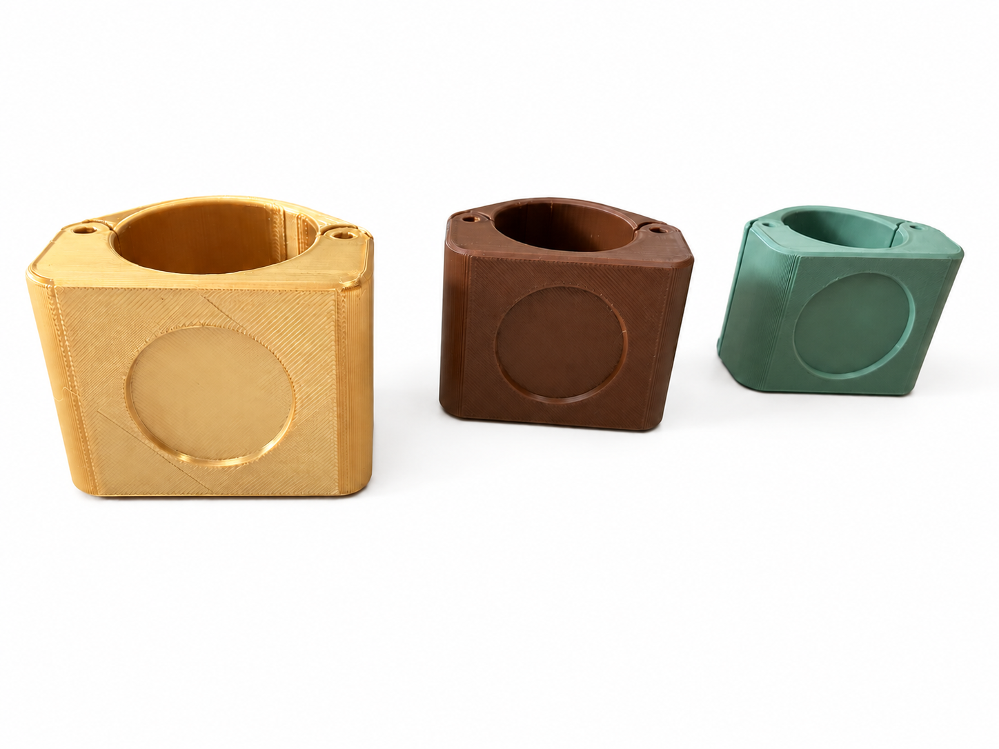 Three RopeID® tag housings in different sizes and colors shown side by side