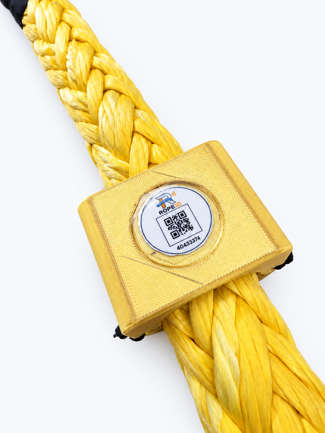 Close product view of a gold RopeID® tag mounted on a yellow synthetic rope